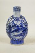 A Chinese blue and white porcelain two handled flask, decorated with figures in a riverside