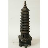 A Chinese bronze model of a tall pagoda, 11¾" high