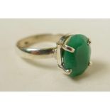 A sterling silver gemstone ring, inset with a 7ct natural green emerald, oval cut, hallmarked, 6g