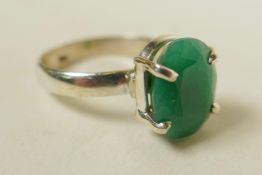 A sterling silver gemstone ring, inset with a 7ct natural green emerald, oval cut, hallmarked, 6g