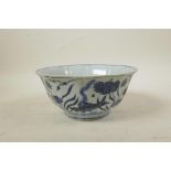 A Chinese Ming style blue and white porcelain bowl of lobed form, decorated with carp in a lotus