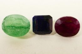 A set of three colour enhances gemstones, a 3.65ct ruby, 5.40ct emerald and a 4.20ct blue