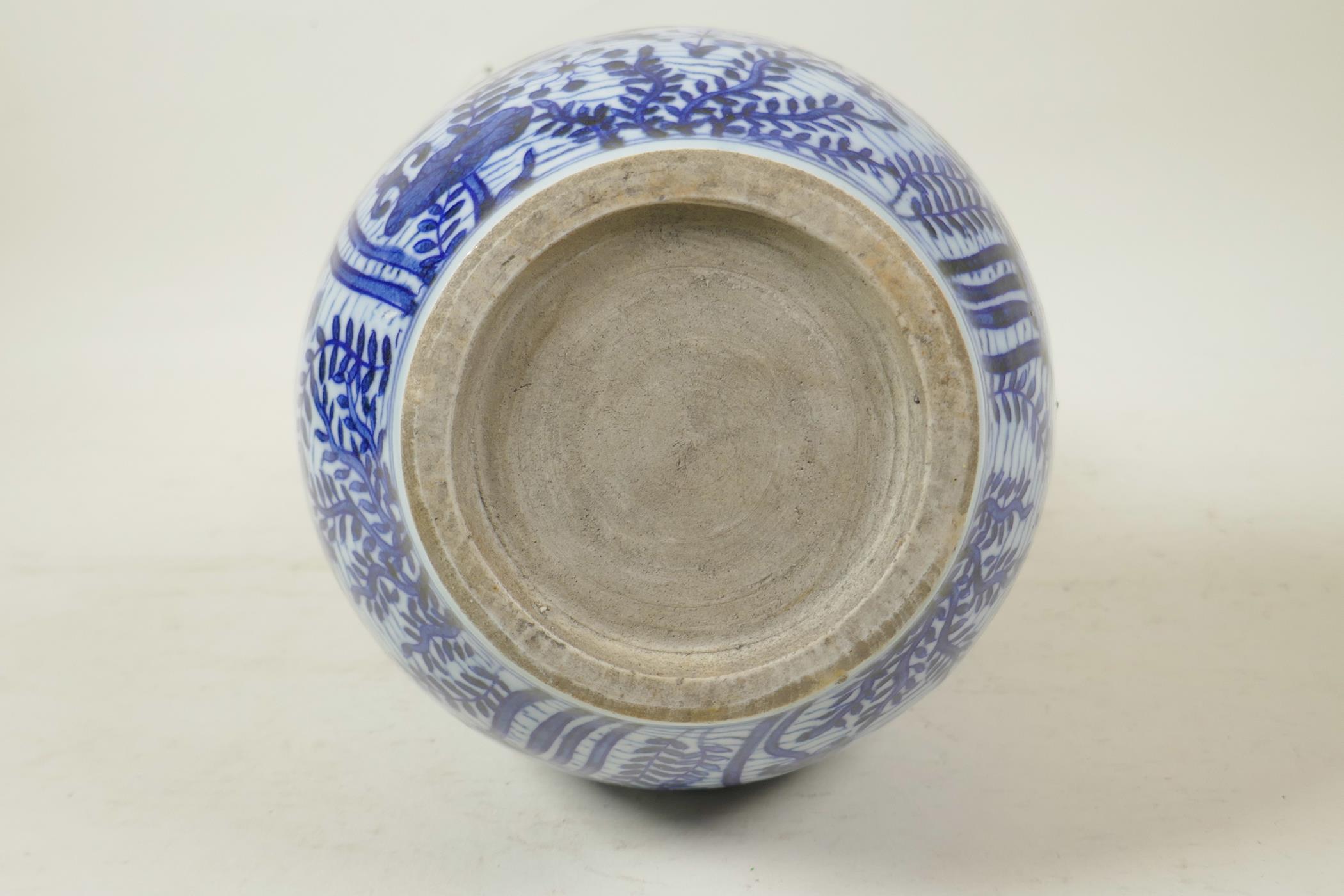 A Chinese Ming style blue and white porcelain double gourd vase decorated with carp in a lotus pond, - Image 6 of 6