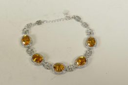 A 925 silver, cubic zirconium and citrine set bracelet, 6½" long