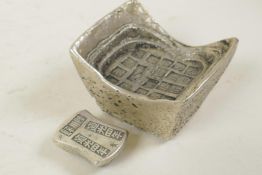 A Chinese white metal trade token/ingot, and another smaller, both with impressed character stamps