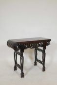 A Chinese hardwood low table with carved and shaped legs and frieze, adapted, 28½" x 13", 23½" high