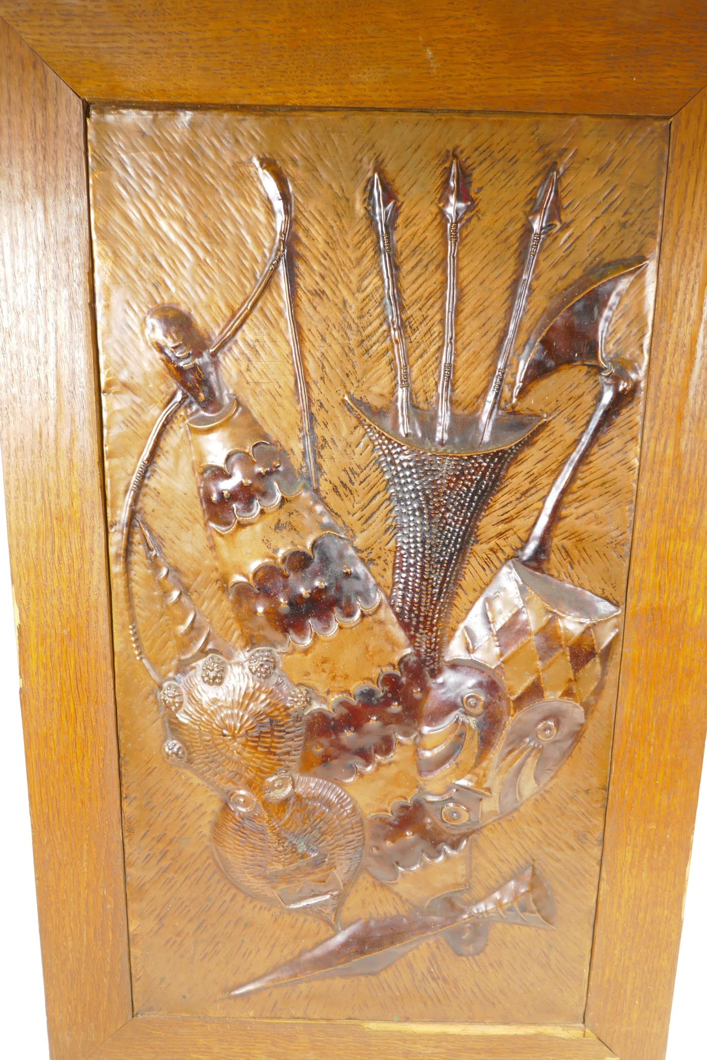 A framed, pressed copper plaque decorated with African figures, 20" x 32" overall - Image 2 of 2