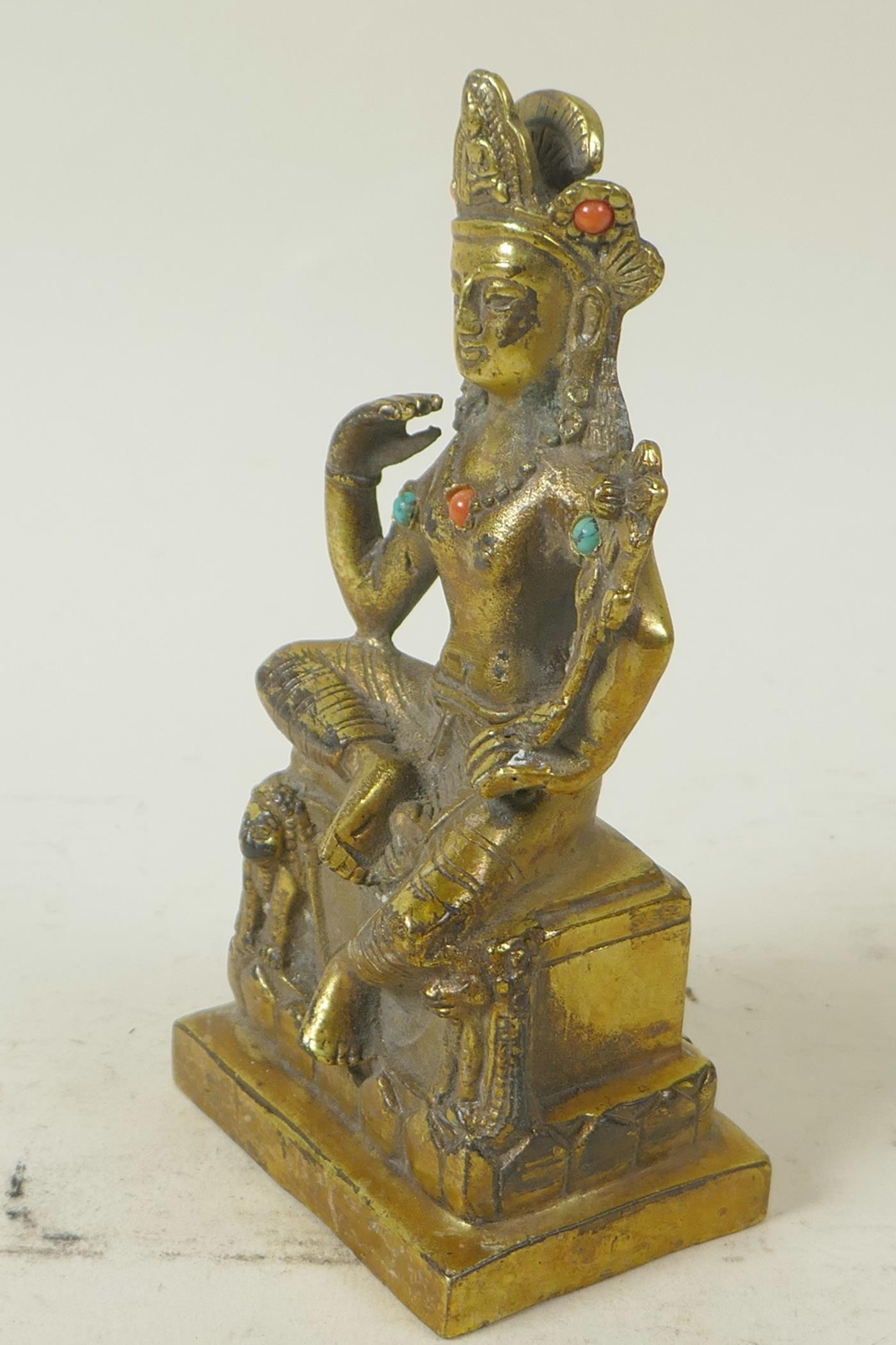 A Sino-Tibetan gilt brass figure of a seated deity embellished with turquoise and coral beads, 5½" - Image 2 of 5