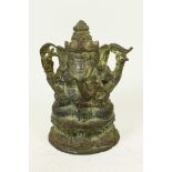 A bronze figure of Ganesh seated on a lotus throne, 5½" high