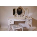 A painted serpentine front five drawer dressing table with triptych mirror and matching stool, 52" x