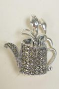 A 925 silver and marcasite set brooch in the form of a watering can, 1½"