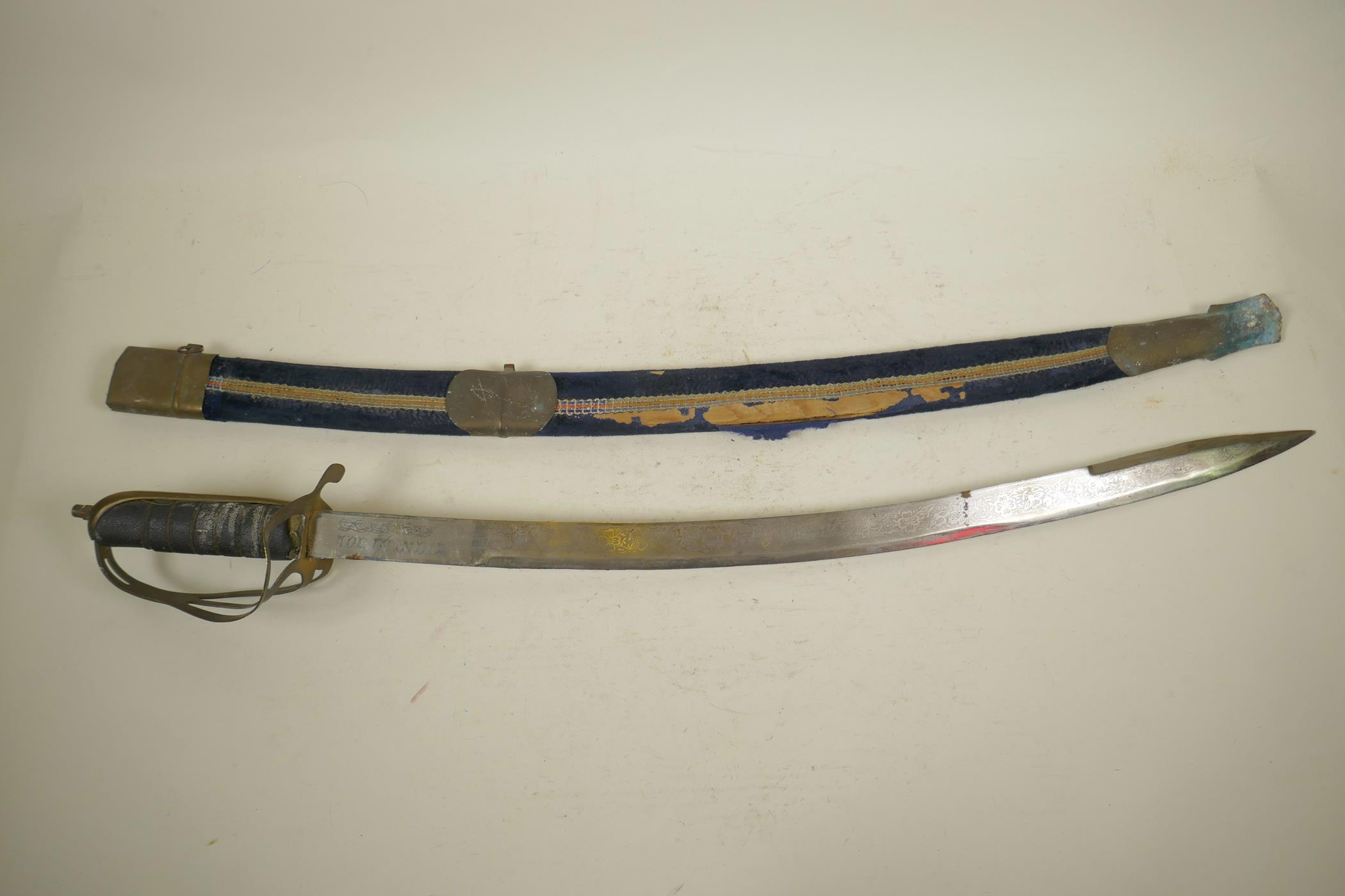 An Indian ceremonial cavalry sword, a WWI replica sabre with 'Made in India' etched to the hilt