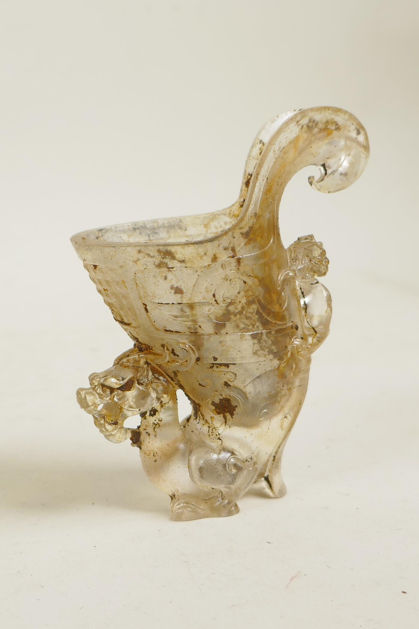 A Chinese crystal style glass jue vessel with dragon decoration, 4" high