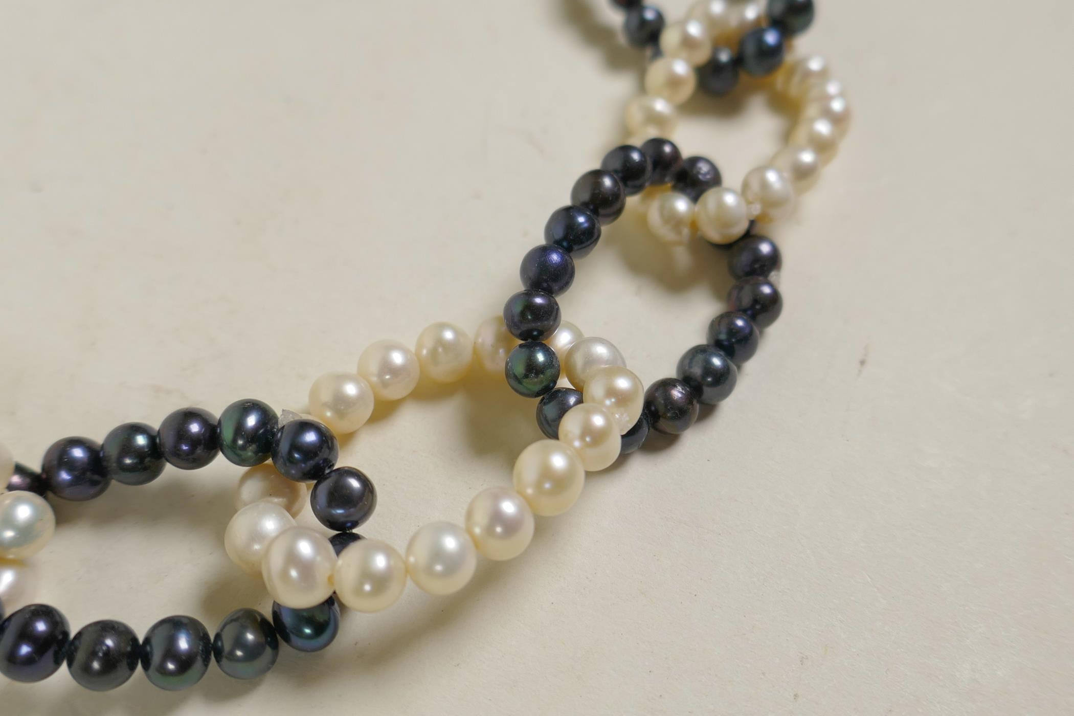 A Tahitian black and white pearl chain link necklace, 28" long - Image 2 of 2