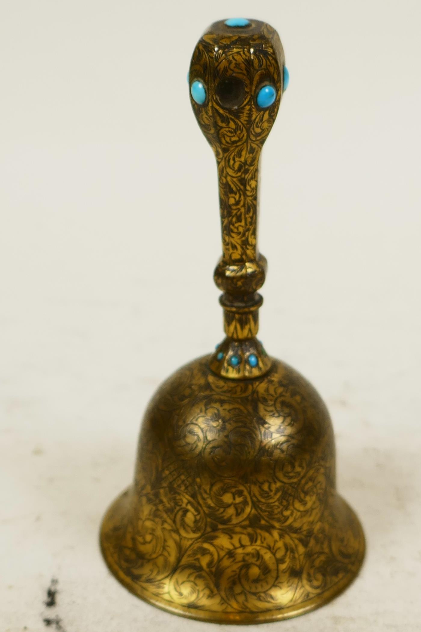A small Oriental brass table bell with engraved floral decoration and inset with turquoise beads, 4" - Image 3 of 3