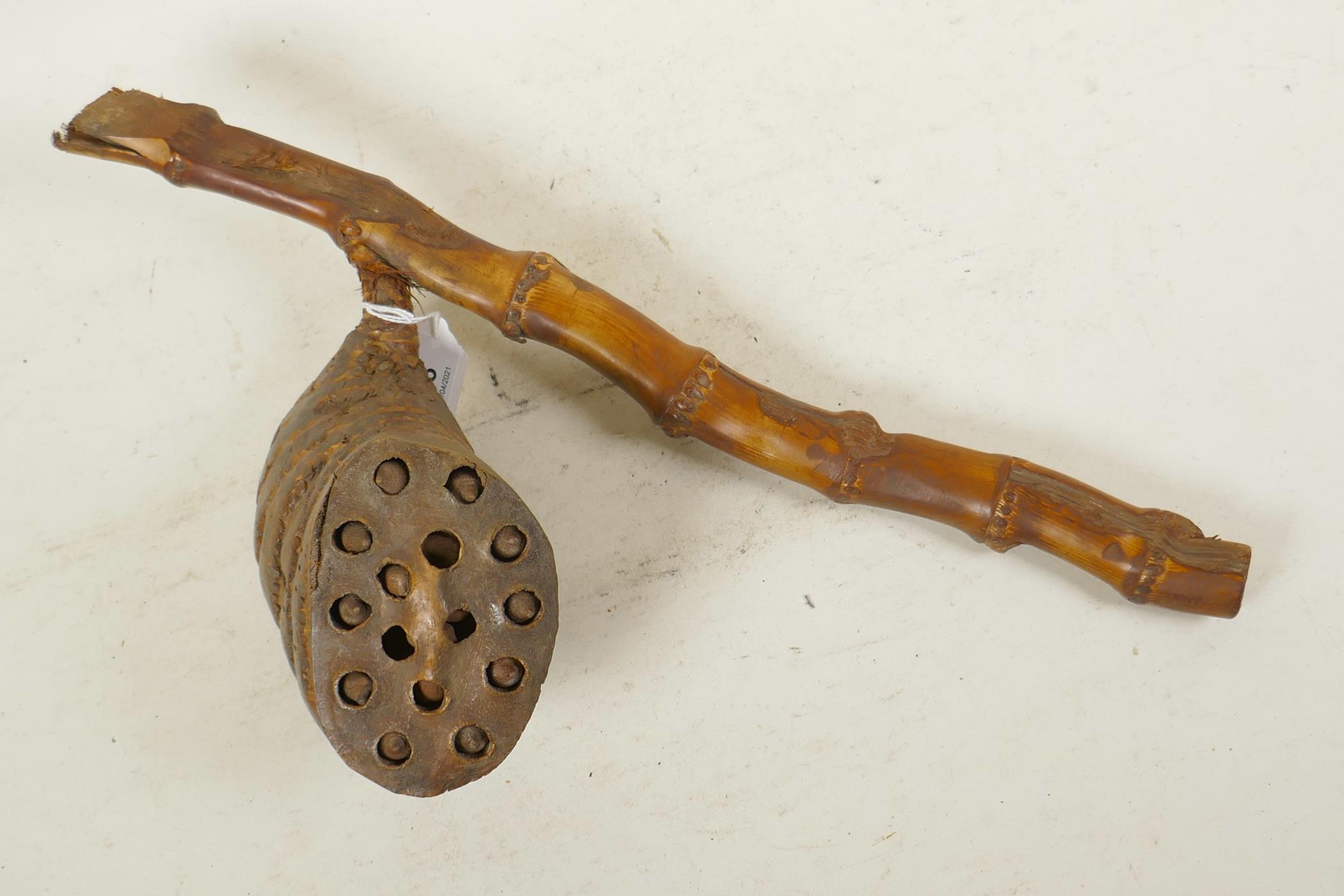 A bamboo root shaker, 16½" long