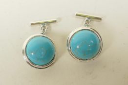 A pair of 925 silver and turquoise set cufflinks