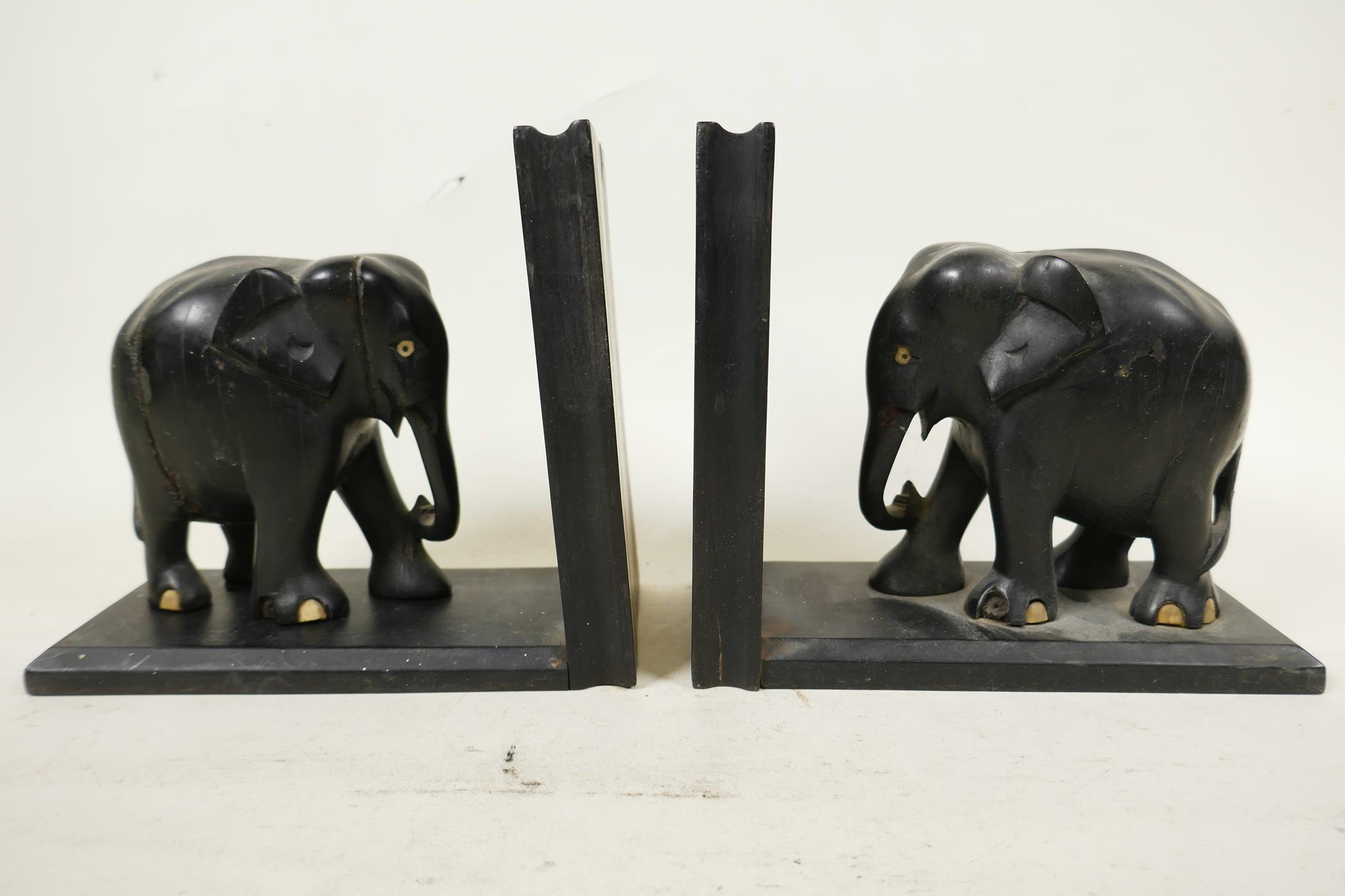 A pair of early C20th ebony carved elephant bookends, one detached from stand, 6" high x 6½" wide, - Image 2 of 8