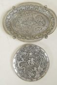 A Chinese white metal trinket dish with dragon and phoenix decoration, and another smaller,