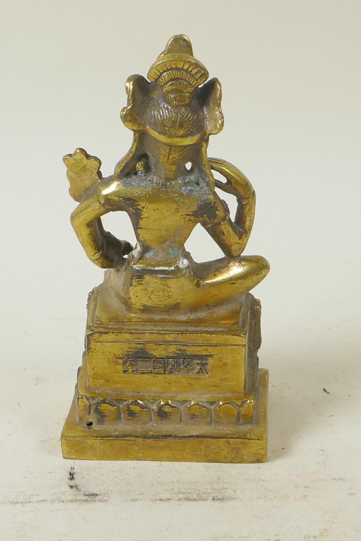 A Sino-Tibetan gilt brass figure of a seated deity embellished with turquoise and coral beads, 5½" - Image 4 of 5