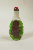 A Chinese Peking glass style snuff bottle decorated with two Immortals, 3" high