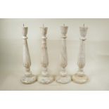 Two pairs of painted and distressed, turned wood pricket candlesticks, 19" high