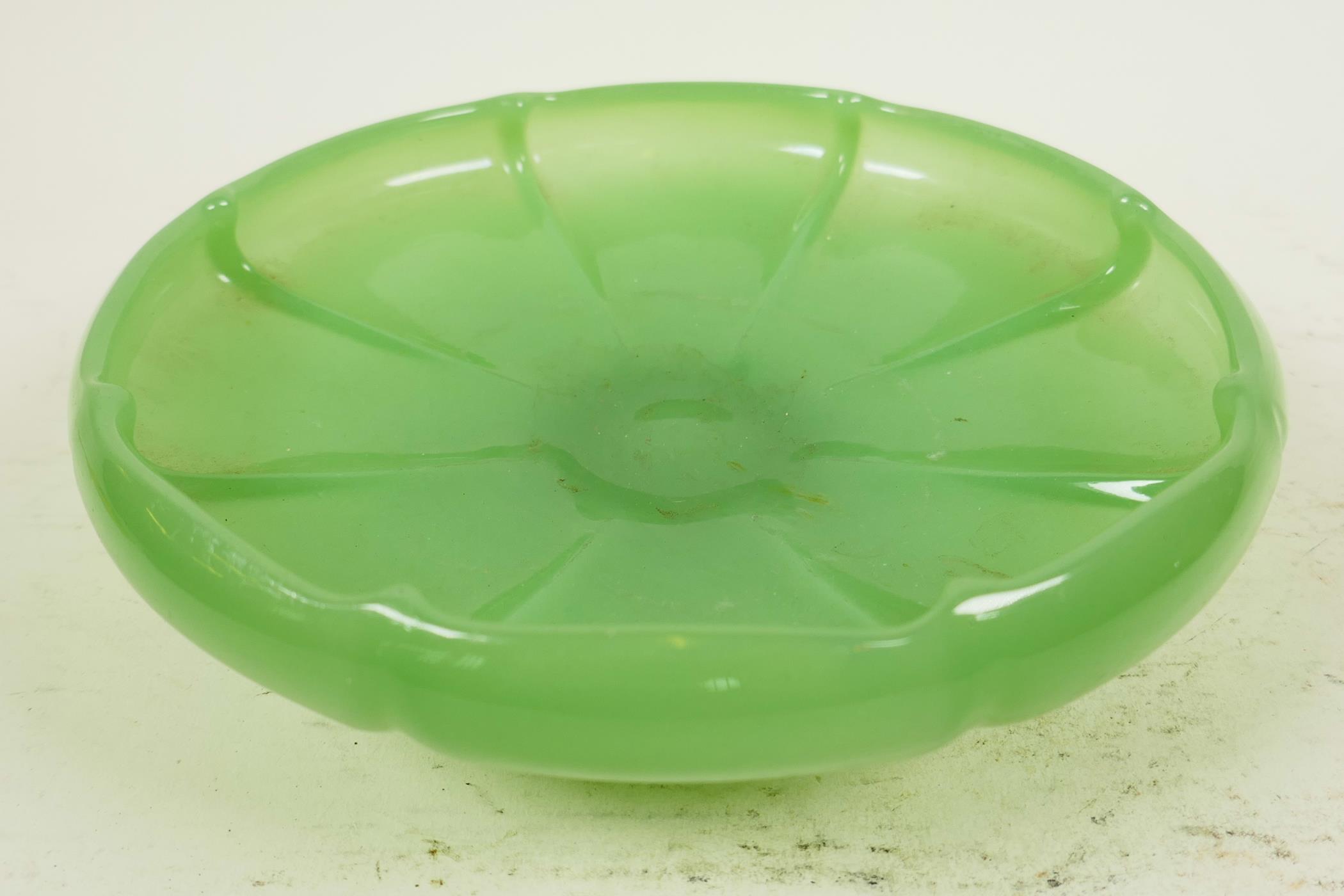 A green Peking glass bowl formed as a lily pad, 7½" diameter