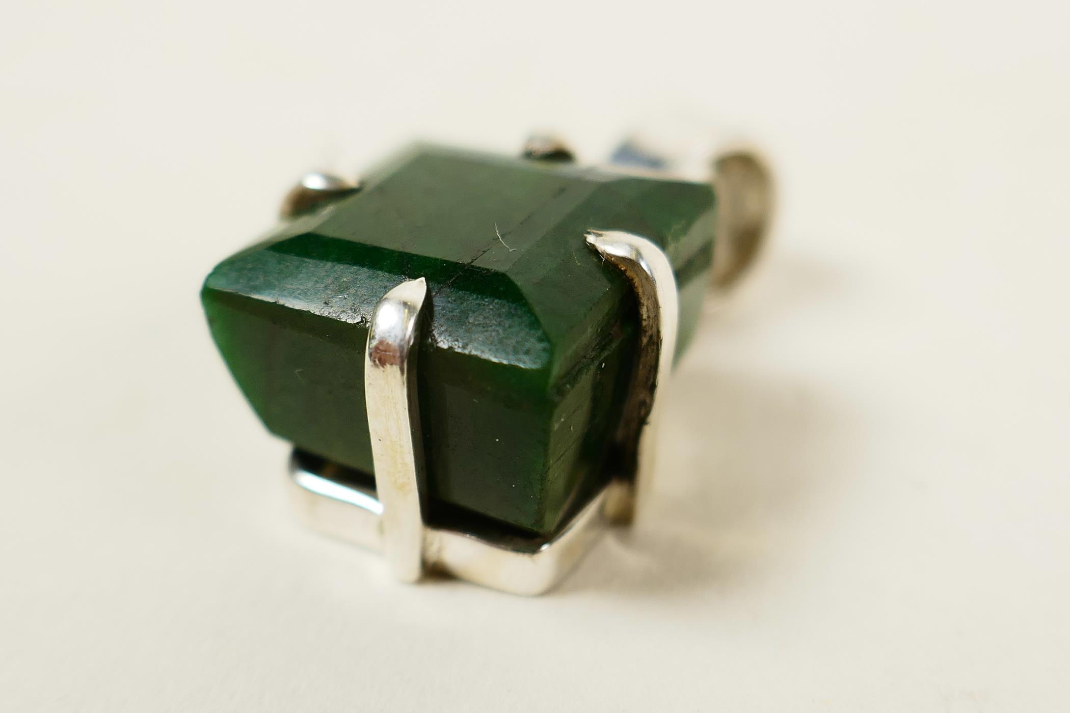 A striking pendant featuring a 12ct square cut natural green emerald, set in sterling silver, - Image 4 of 5