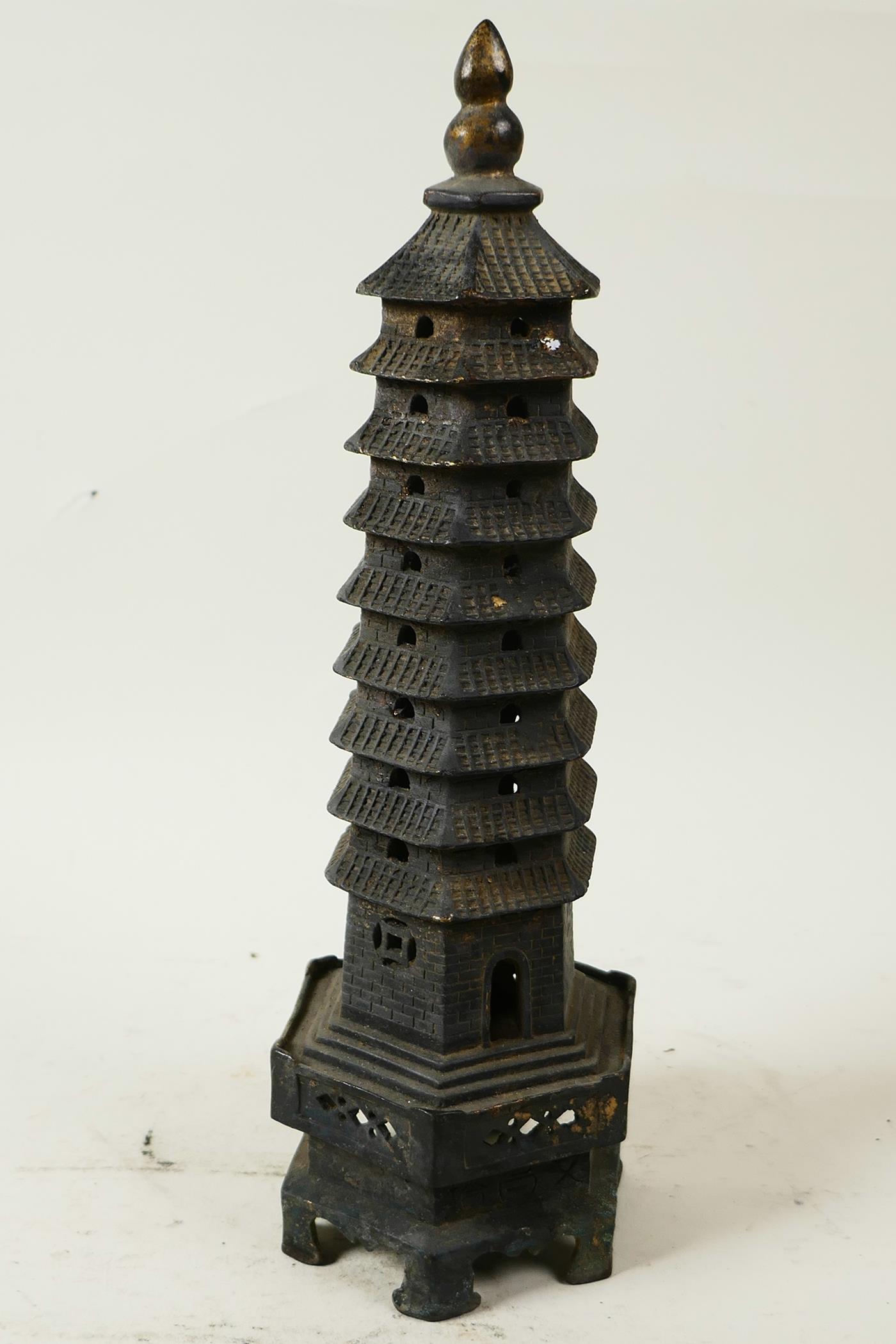 A Chinese bronze model of a tall pagoda, 11¾" high - Image 2 of 3