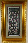 A Chinese silk embroidery depicting the One Hundred Boys, framed, 19" x 32"