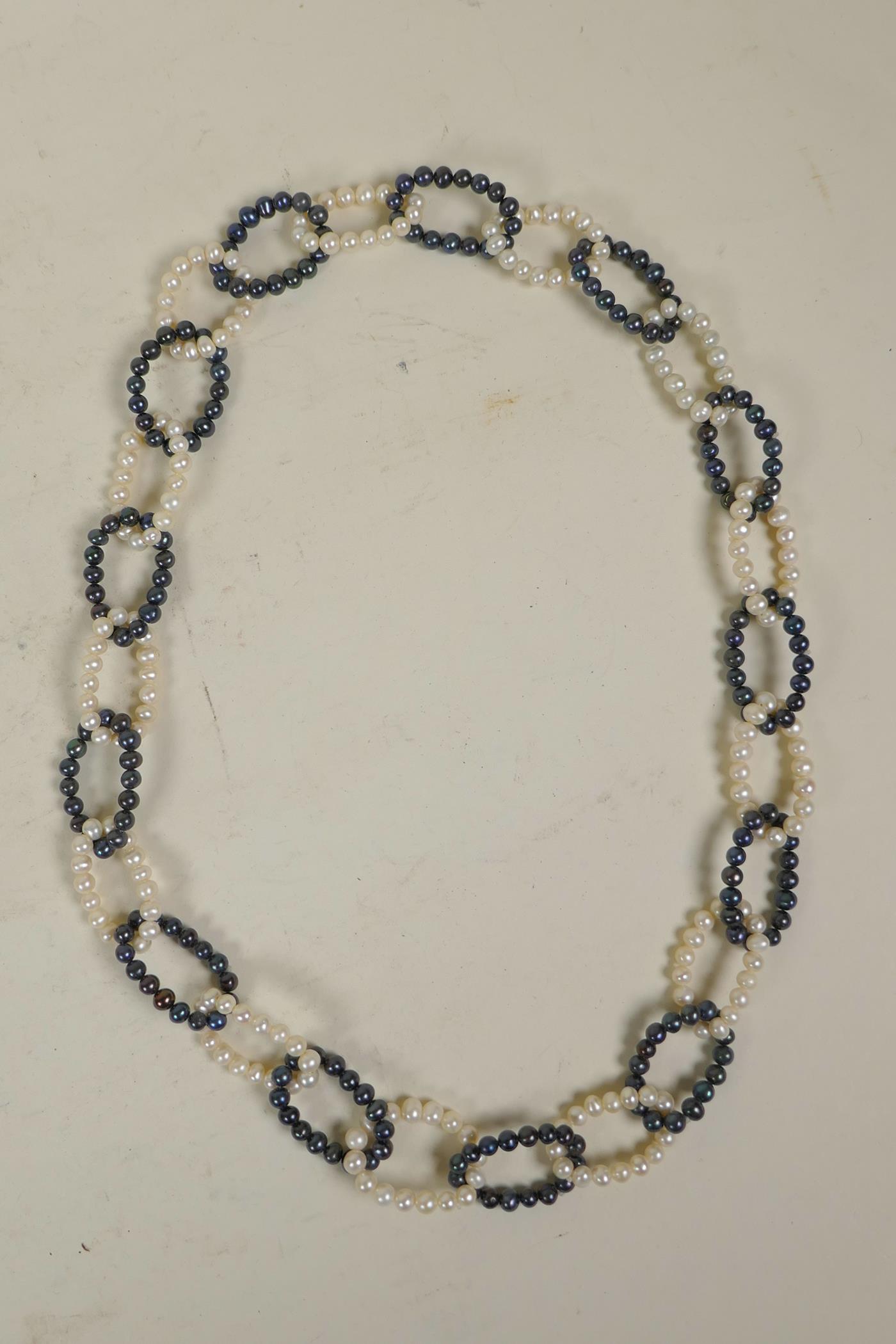 A Tahitian black and white pearl chain link necklace, 28" long