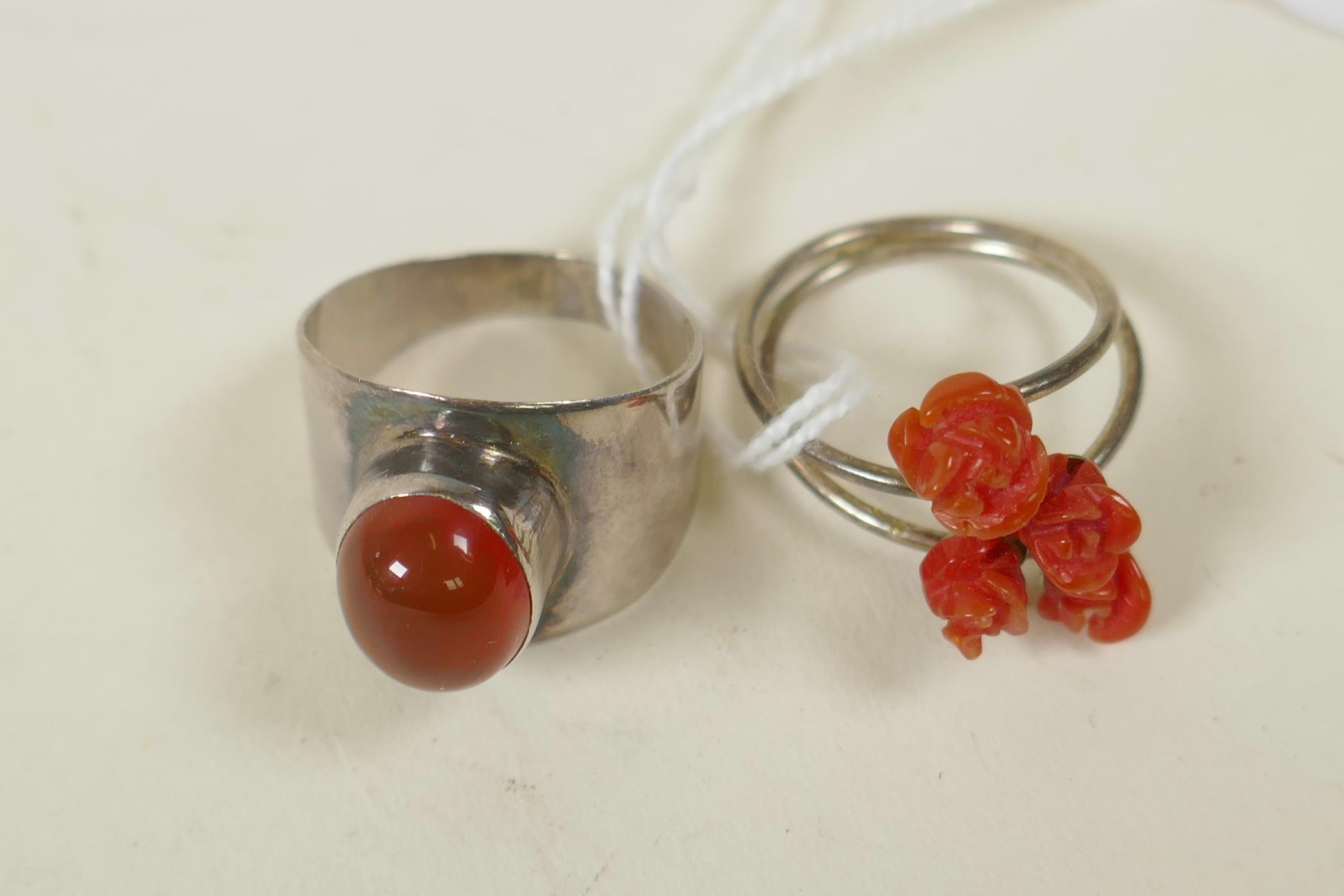 A retro 925 silver and carnelian set ring, and a silver crossover ring set with coral carved in - Image 2 of 2