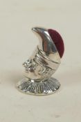 A novelty sterling silver pincushion in the form of a jester, 1¼"