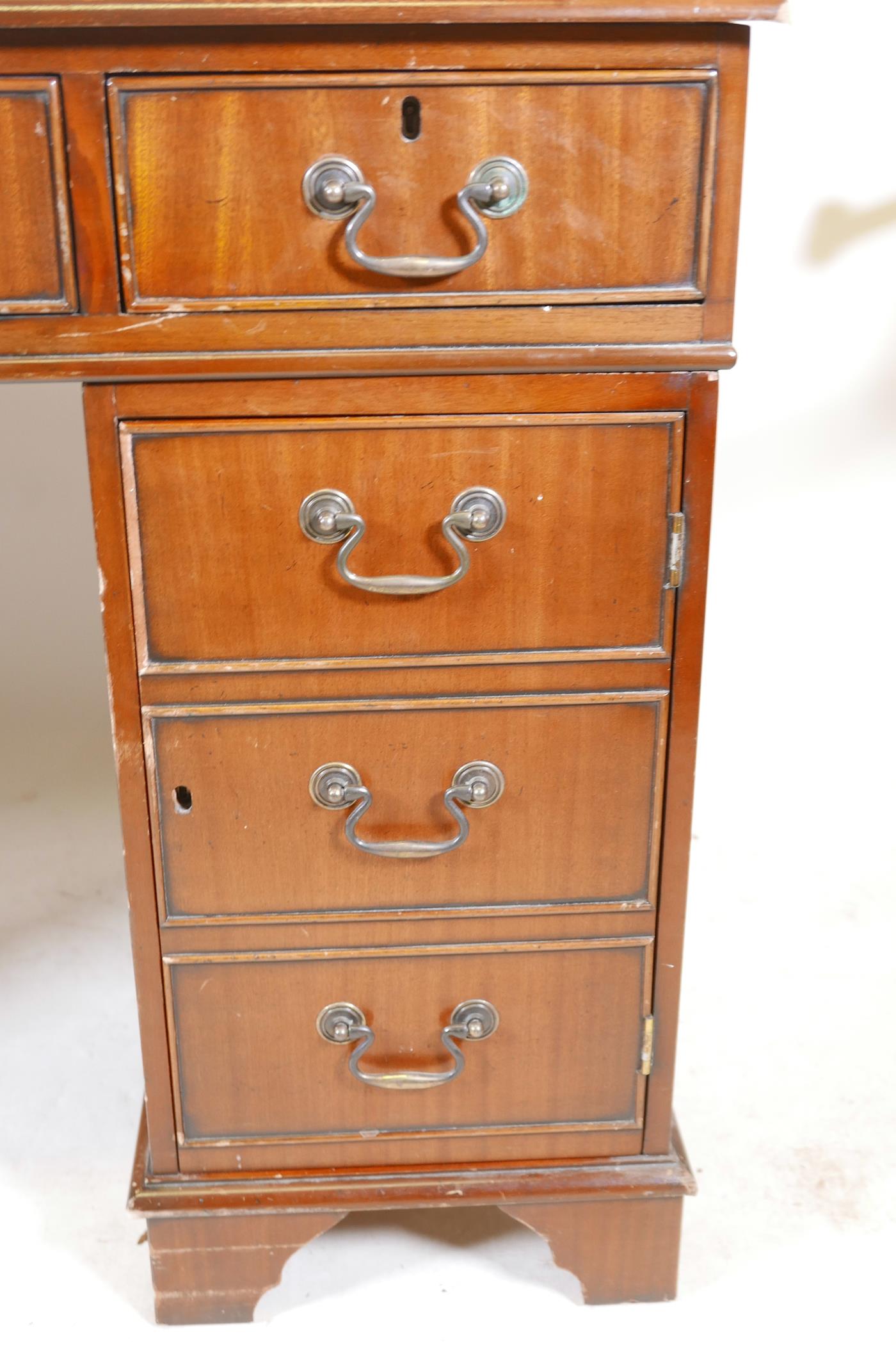 A mahogany pedestal desk with a tooled inset top, hidden keyboard drawer/slide, drawers and a - Image 3 of 6