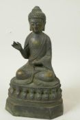 A Chinese bronze figure of Buddha seated in meditation on a lotus throne, seal mark to back, 9" high