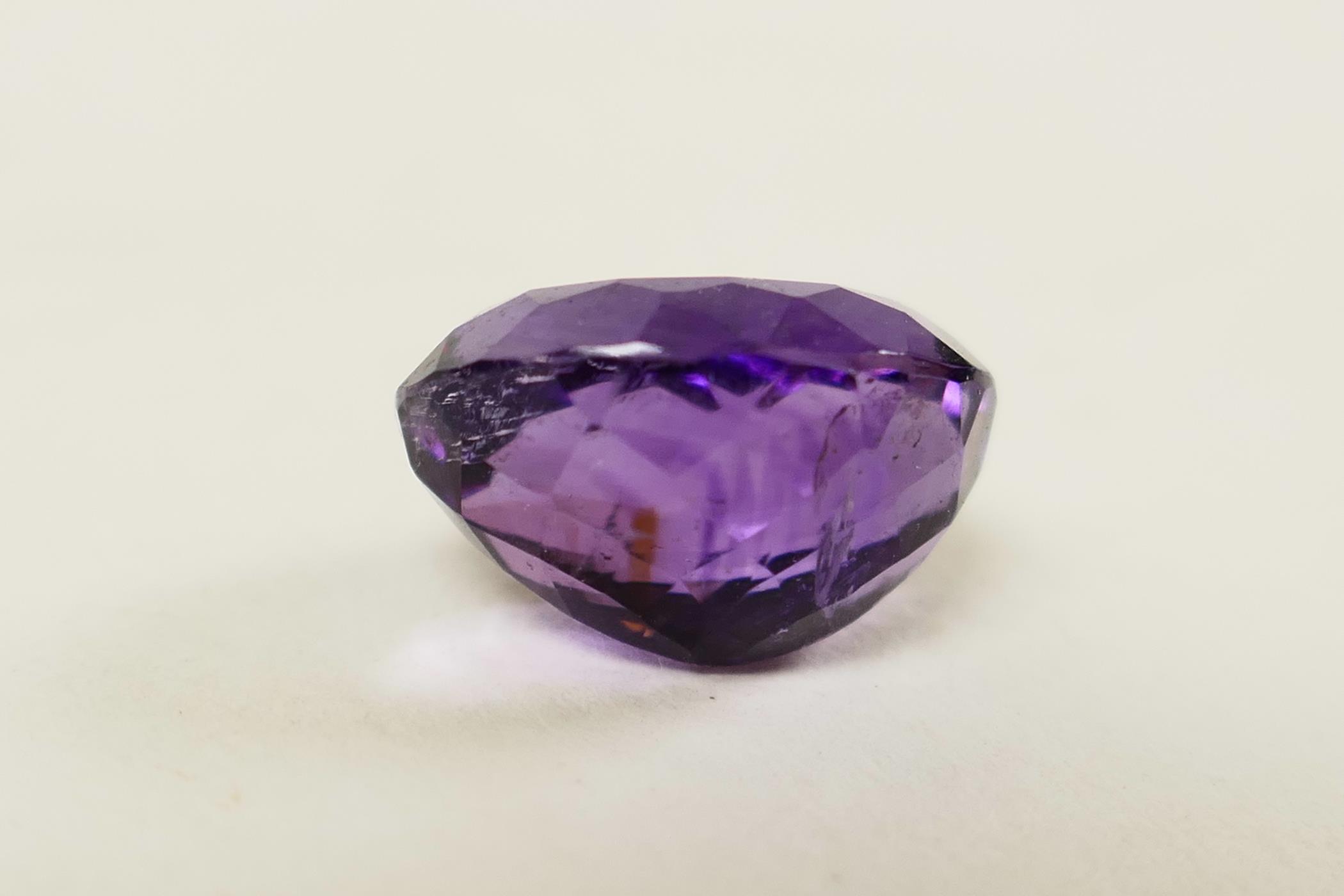 A 6.04ct natural dark purple amethyst, oval mixed cut, certified laboratory tested, with certificate - Image 3 of 5