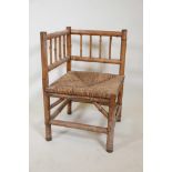 A bamboo corner chair with woven rush seat