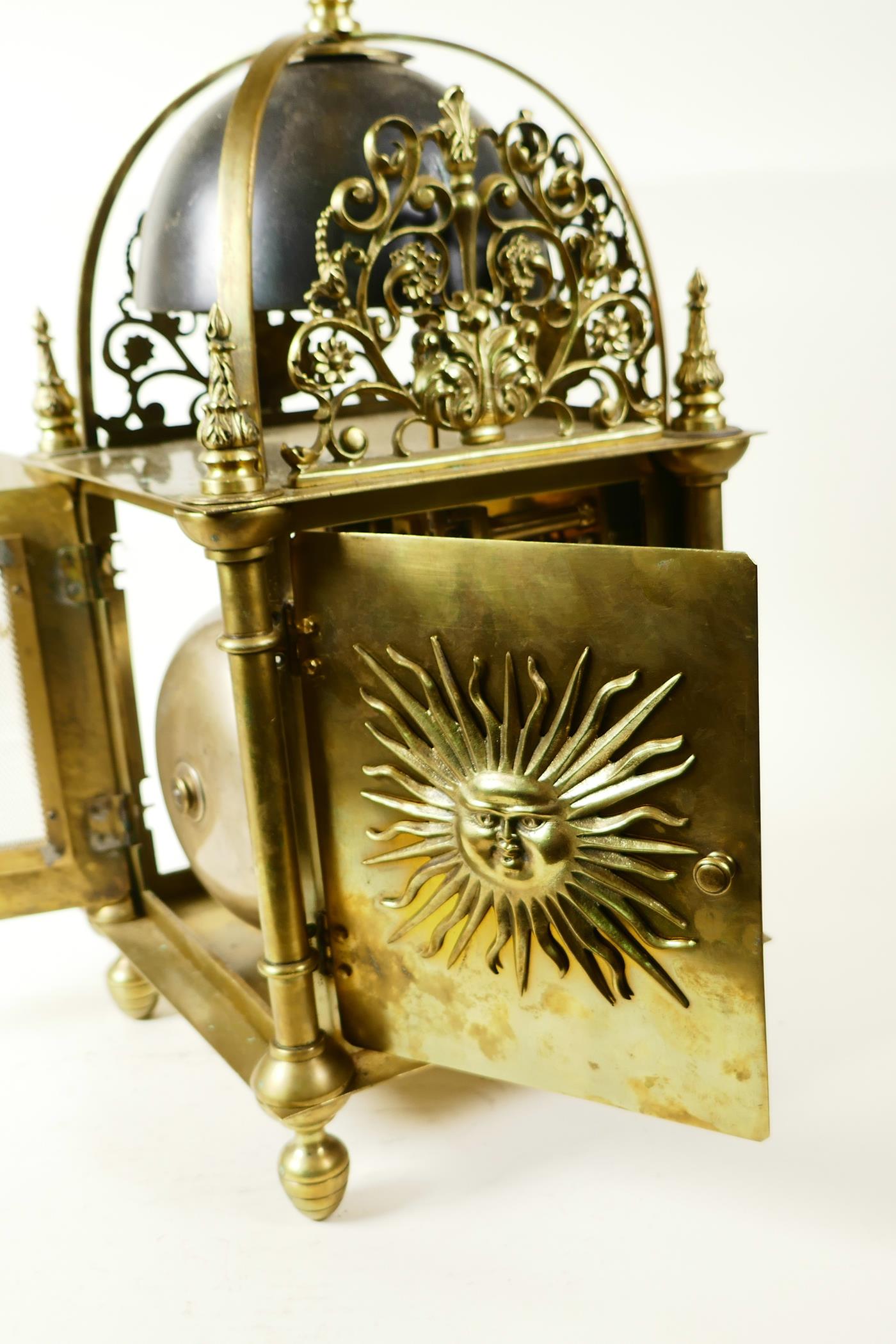 A brass cased lantern clock with two train movement striking on a gong, the case with cast - Image 6 of 7