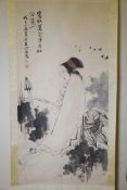 A Chinese watercolour scroll decorated with a stylised lady with flowers in her hair, 27" x 53"