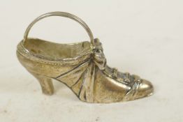 A silver plate with 925 mark pincushion in the form of a lady's high heel shoe, 2½" long, cushion