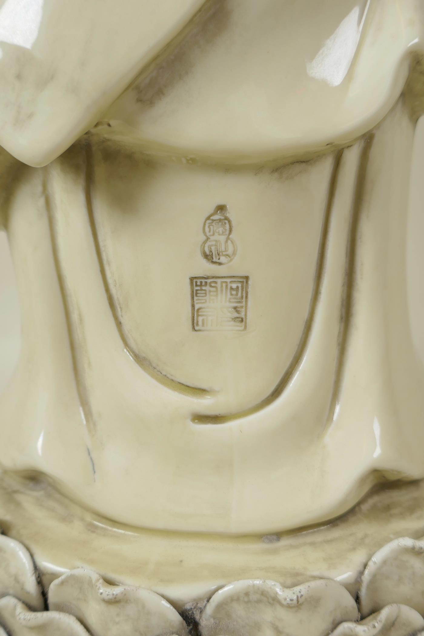 A Chinese blanc de chine porcelain porcelain figure of Buddha standing on a lotus throne, - Image 4 of 5