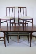 A mid century Afromosia 'Fonseca' dining table and six matching chairs, with tapered back splats,