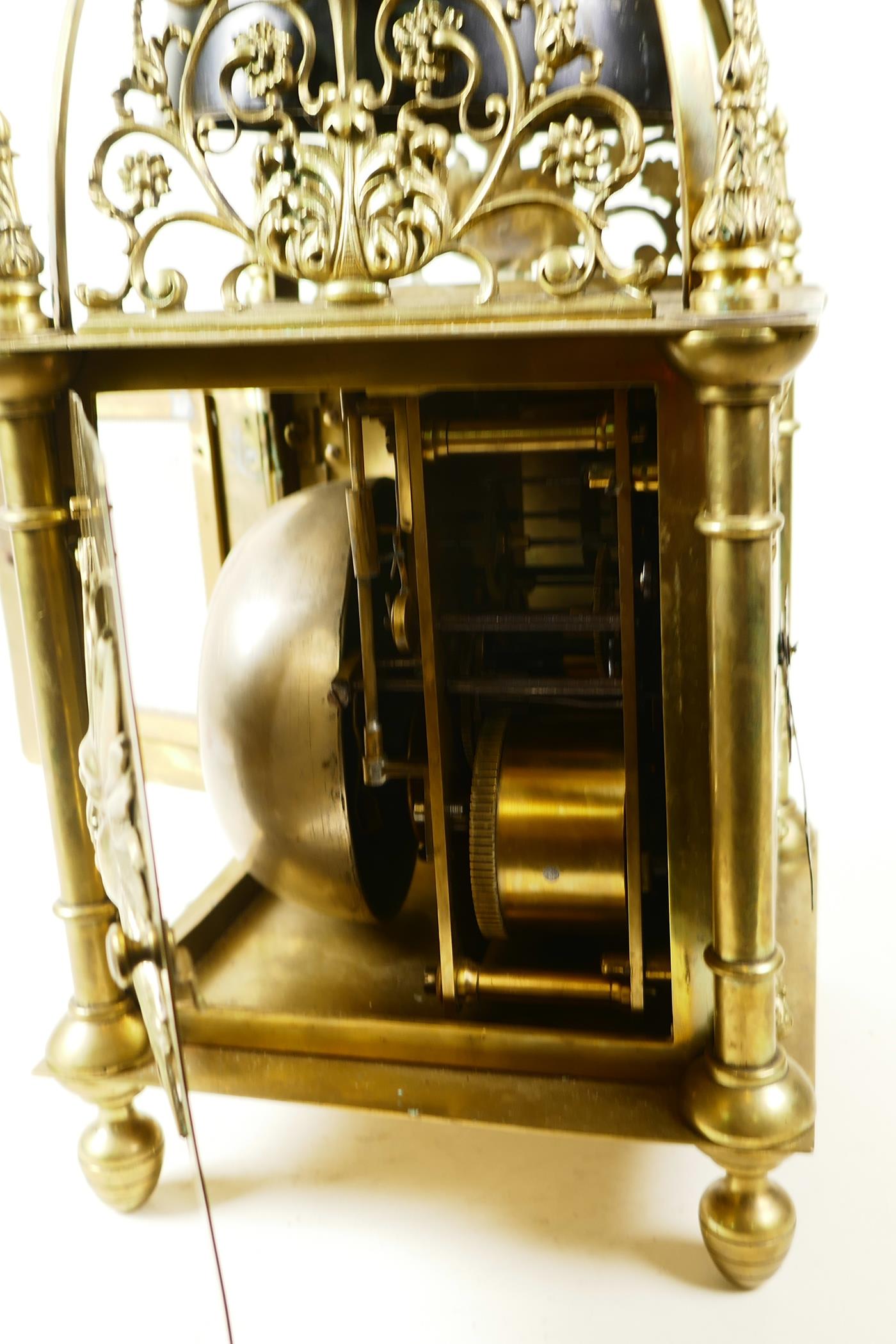 A brass cased lantern clock with two train movement striking on a gong, the case with cast - Image 7 of 7
