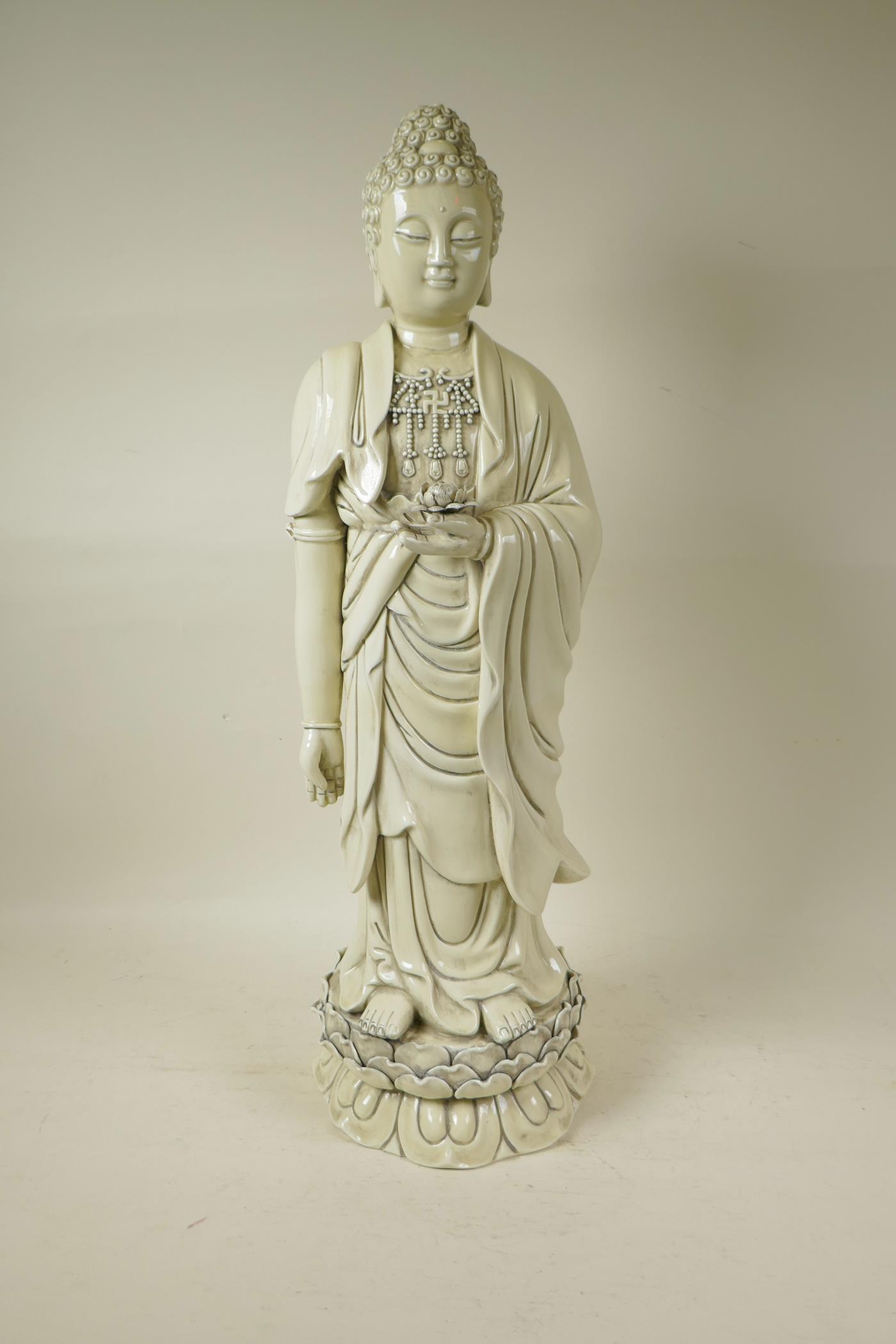 A Chinese blanc de chine porcelain porcelain figure of Buddha standing on a lotus throne,