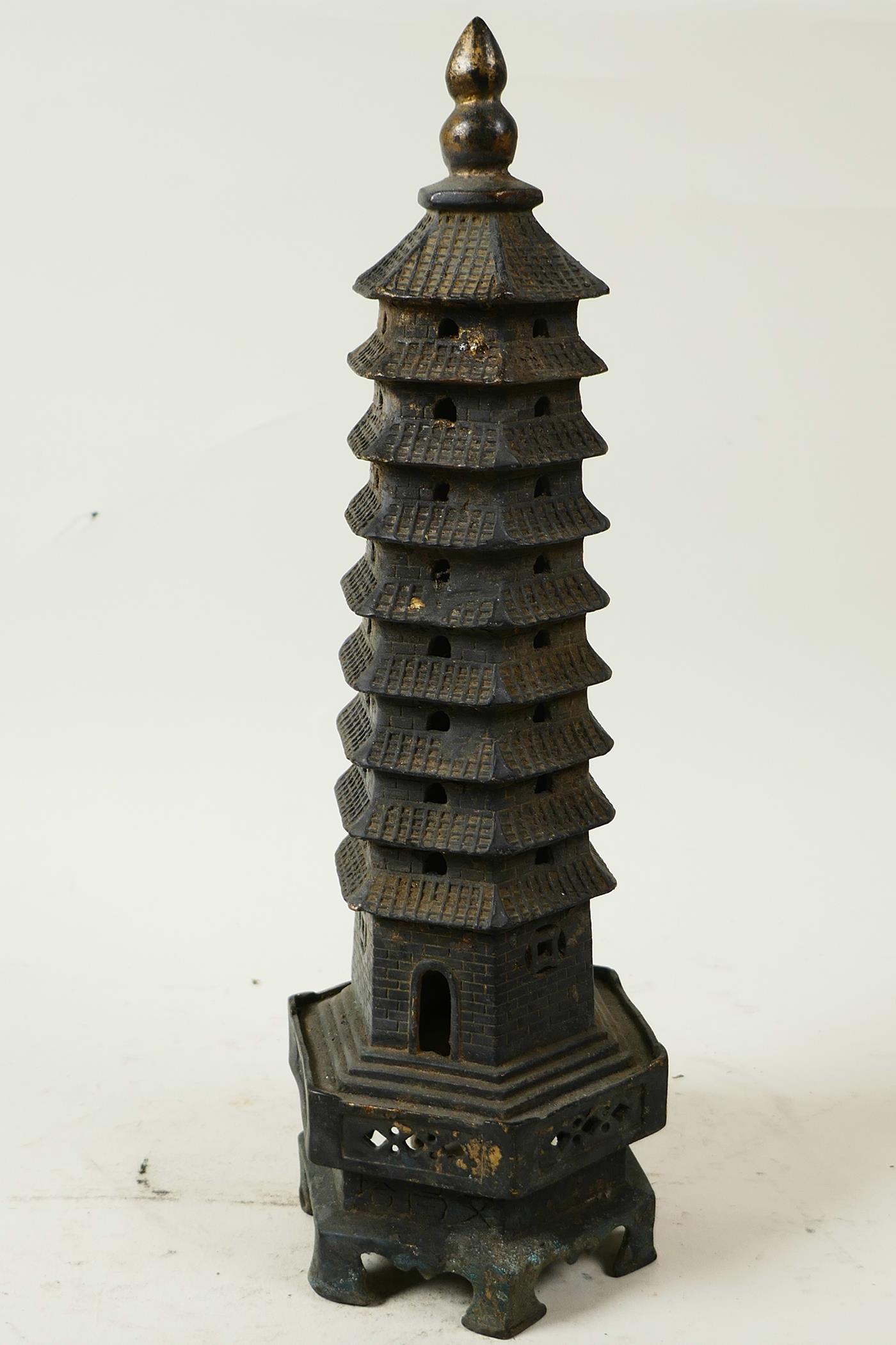 A Chinese bronze model of a tall pagoda, 11¾" high