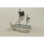 A 925 silver miniature boat, 1½" long