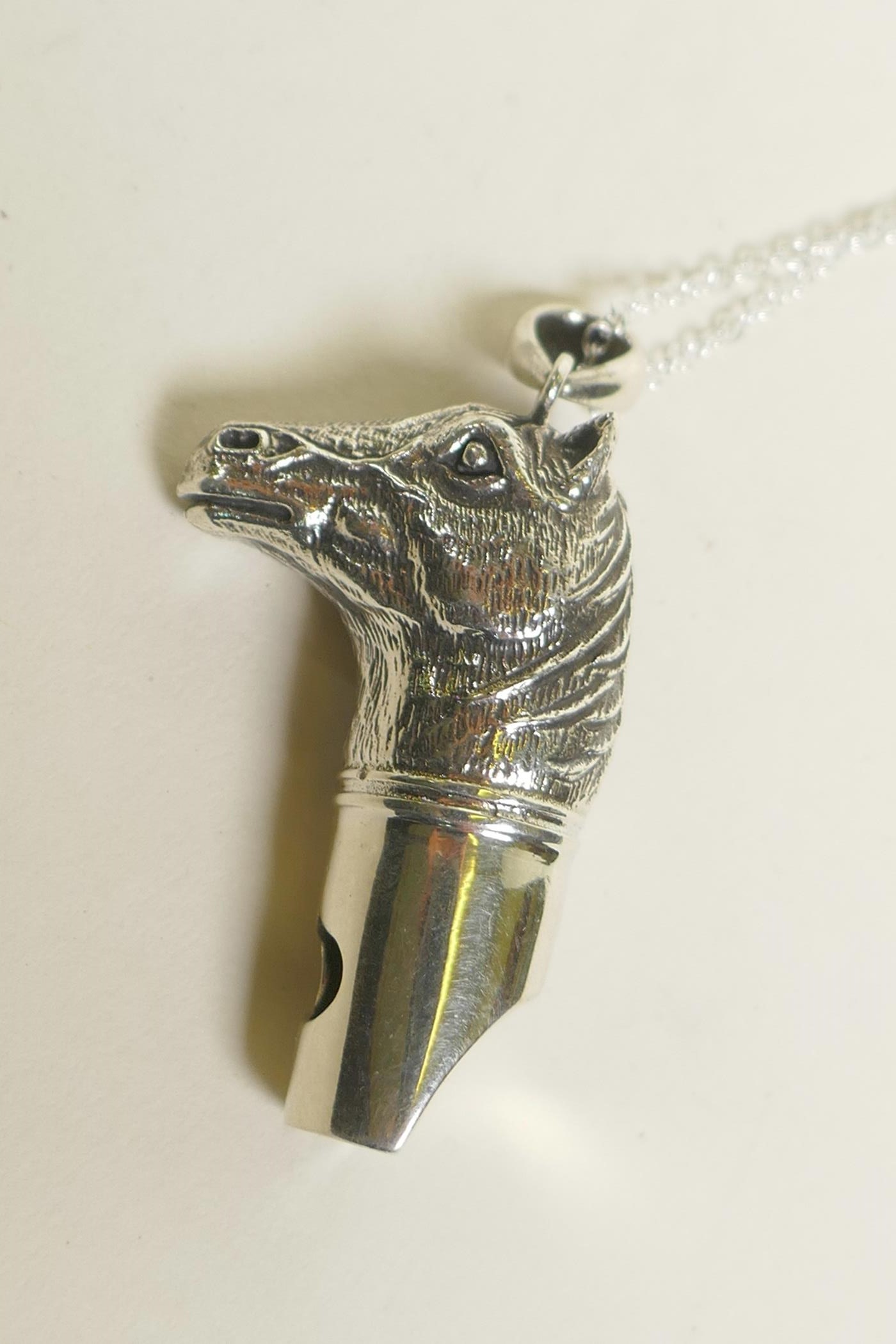A sterling silver pendant whistle in the form of a horse head, 1½" - Image 2 of 2
