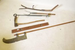 A collection of vintage gardener's tools including a pitchfork auger and brades, British Rail