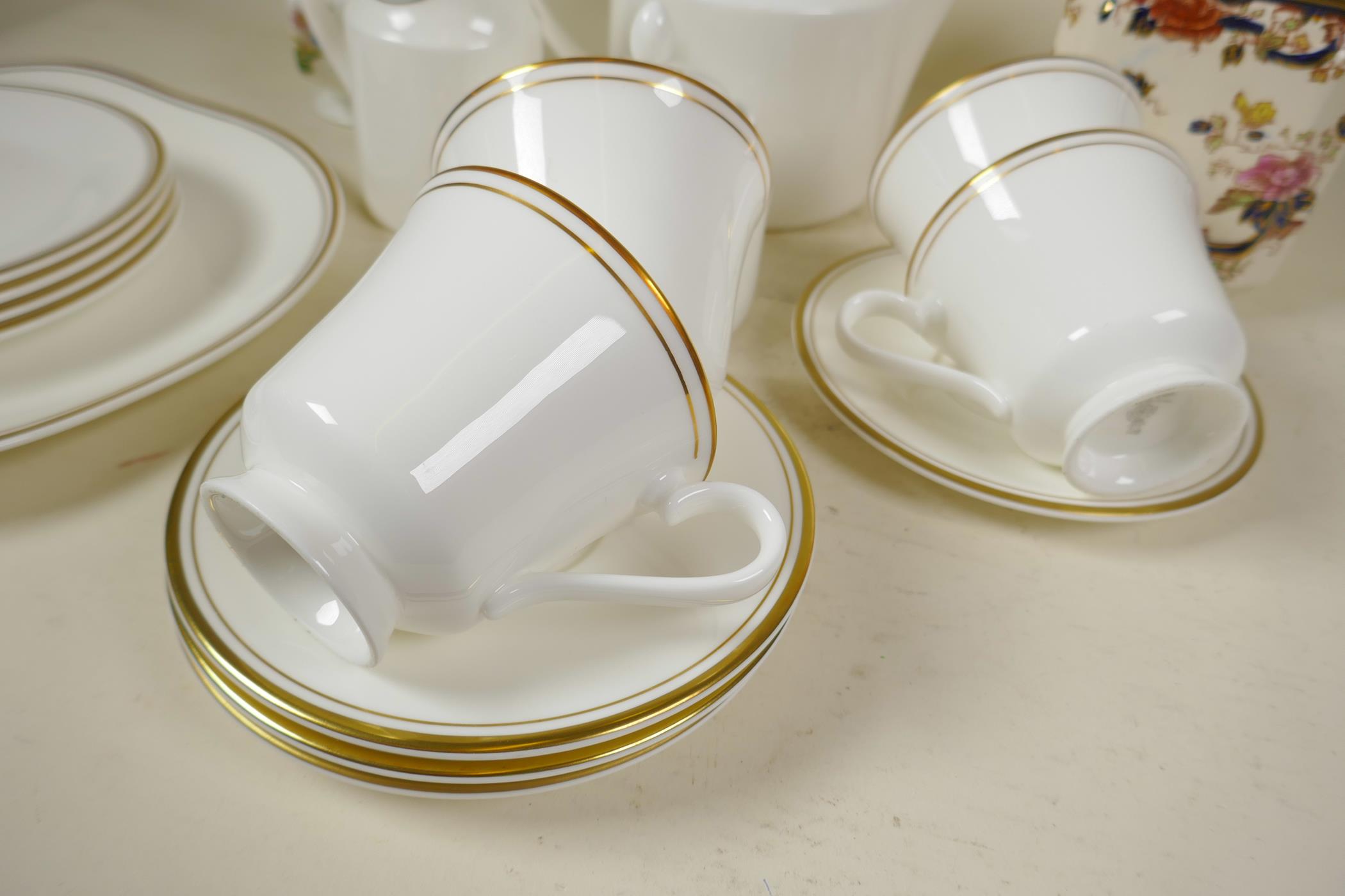 A Royal Doulton gold Concorde pattern white and gilt tea service comprising teapot, milk jug and - Image 2 of 3