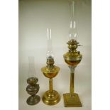 Three late Victorian brass oil lamp burners including glass chimneys, two beautifully cast in a